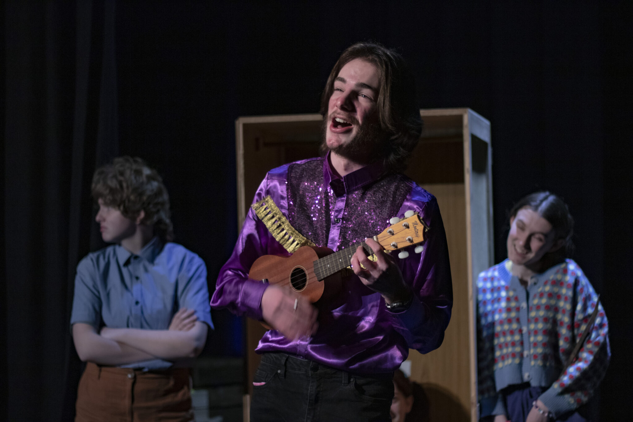 Kenny Batts singing to Mr. Fowler and Ms. Dunning about his daughter, Rowena, who has locked herself in the stationery cupboard (Kieran Darmody, Me, Zoe Smith. Also half of Jasmine White's face).