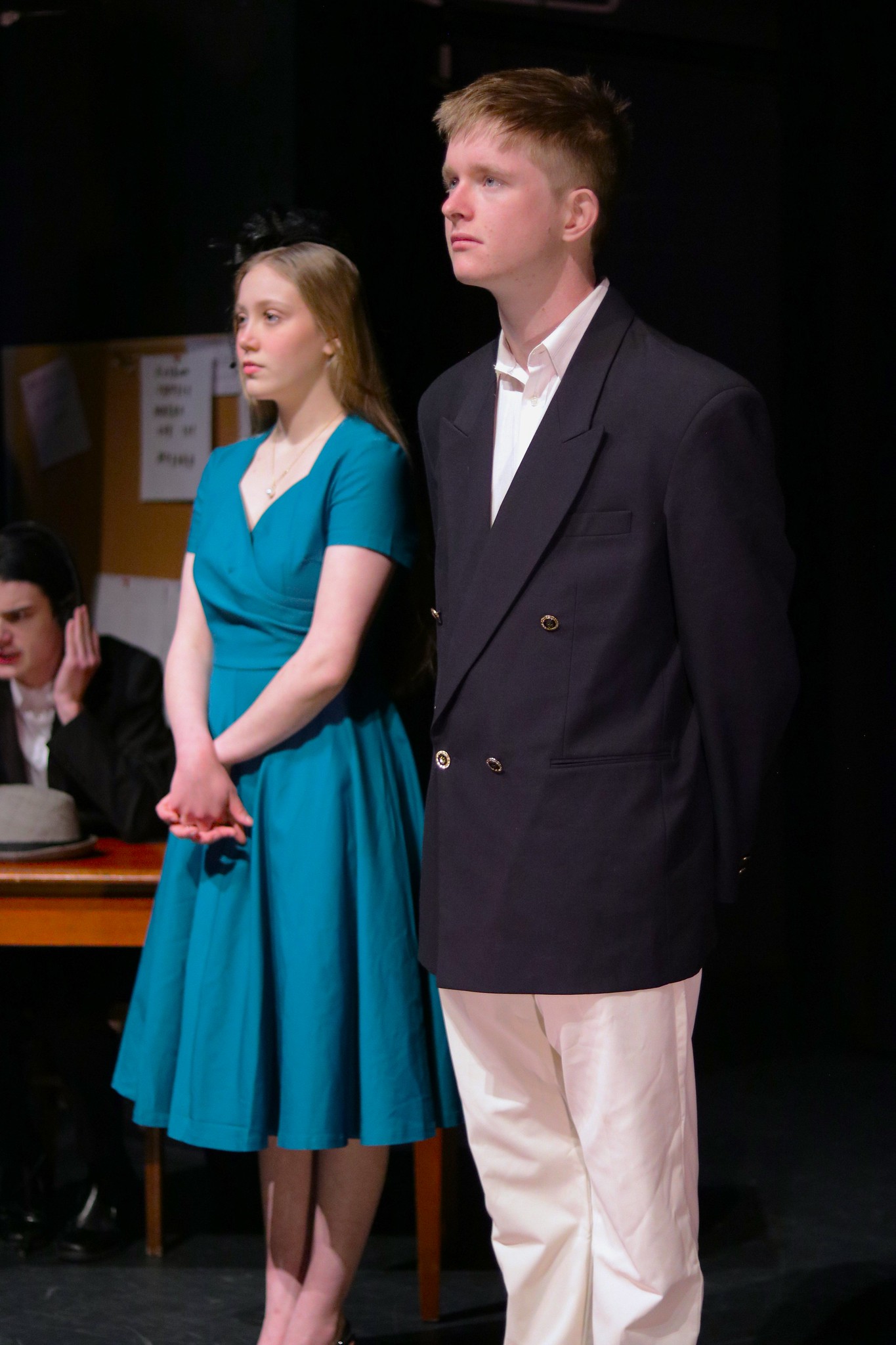 The Radio News Reporter (me) reporting on Mrs. Monty's trial, introducing Bobby Lulham (Conor McLauchlan) to the court while his wife, Judith (Lauren Shaw), watches on.